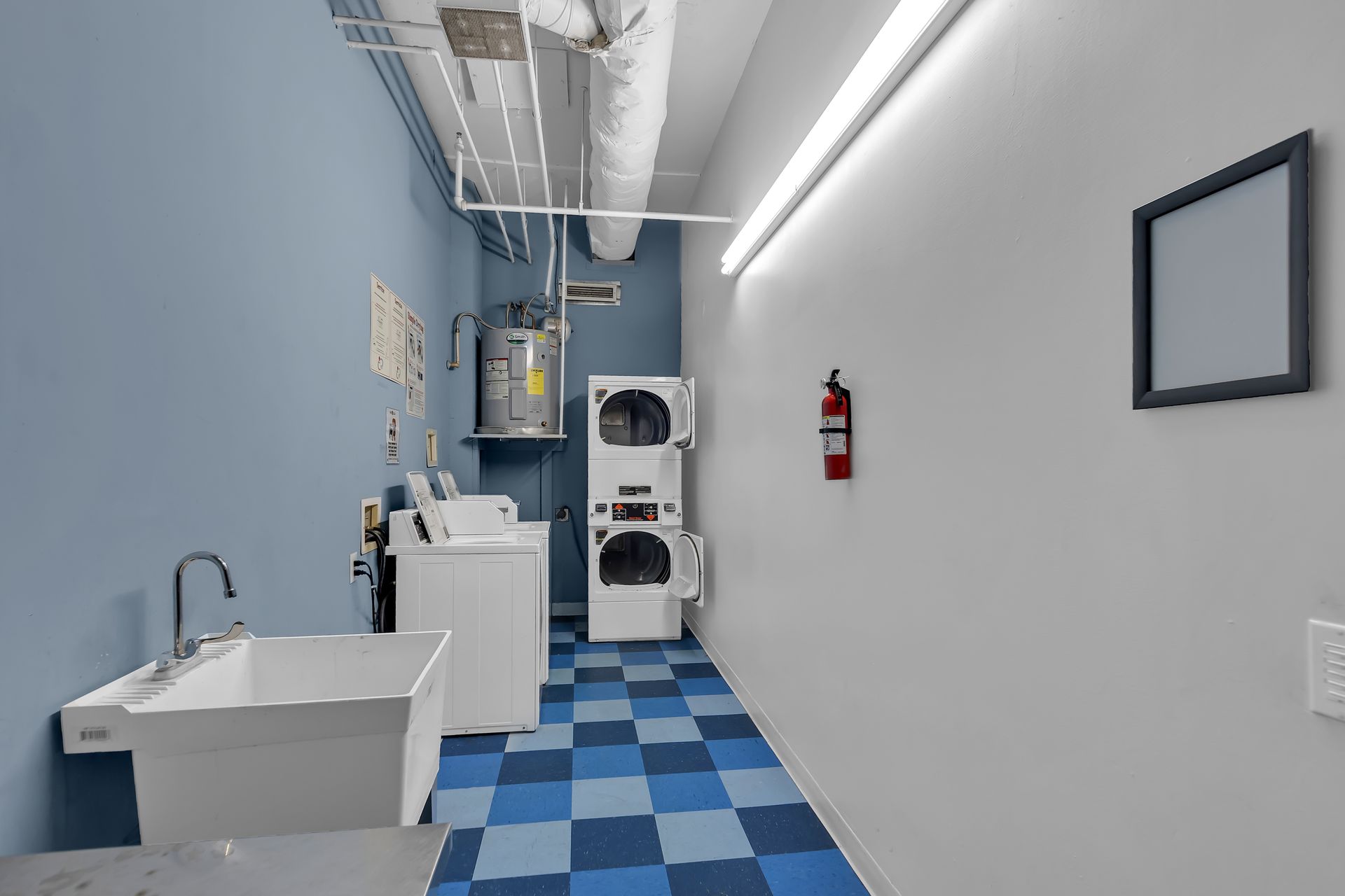 On-site laundry room with washers and dryers at 1900 Elm Lofts