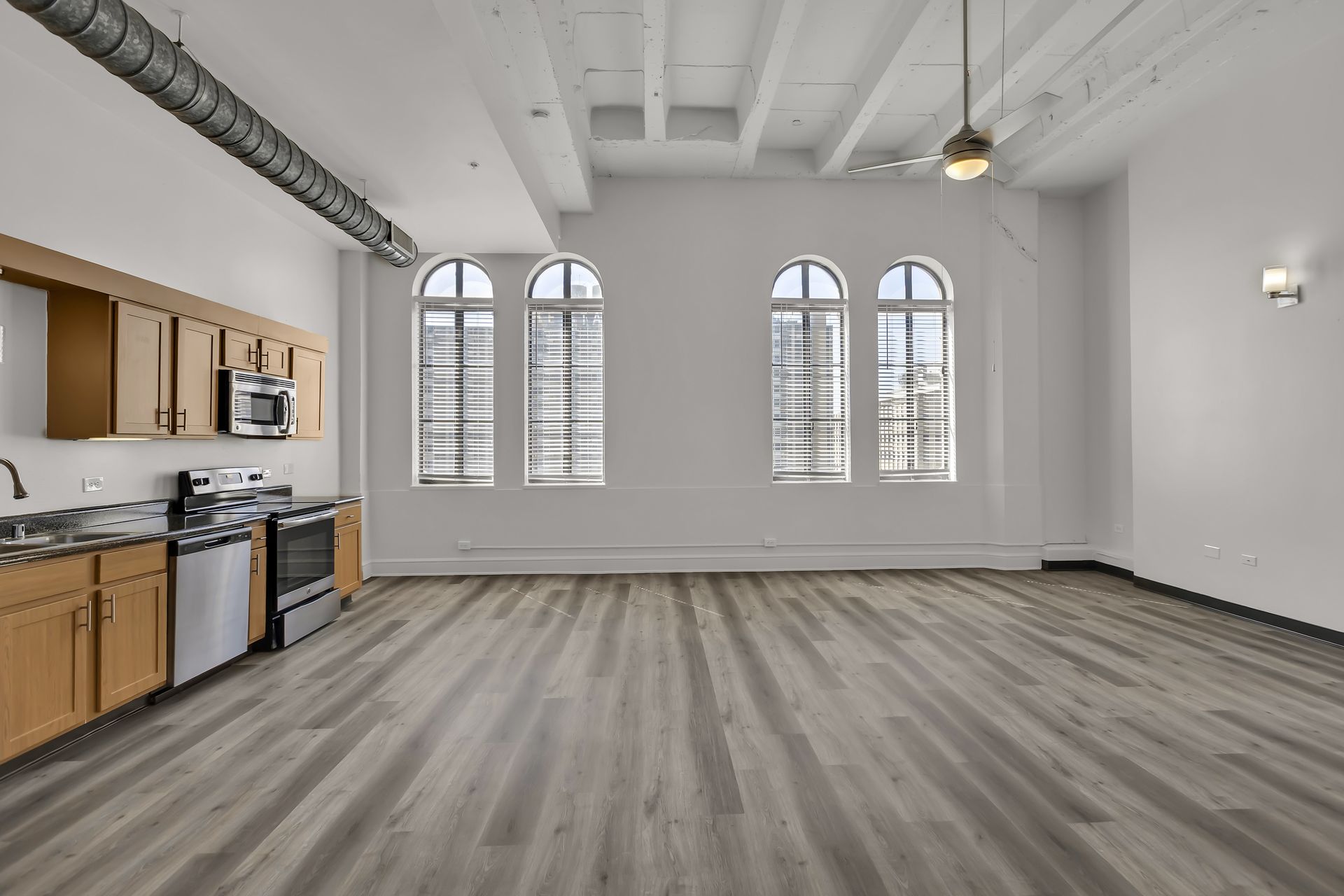 Large Loft with three tall windows and open kitchen, 1900 Elm Lofts